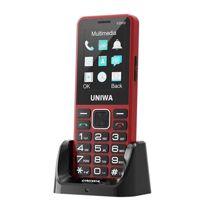 Téléphone UNIWA V2000 4G rouge sur son socle de charge